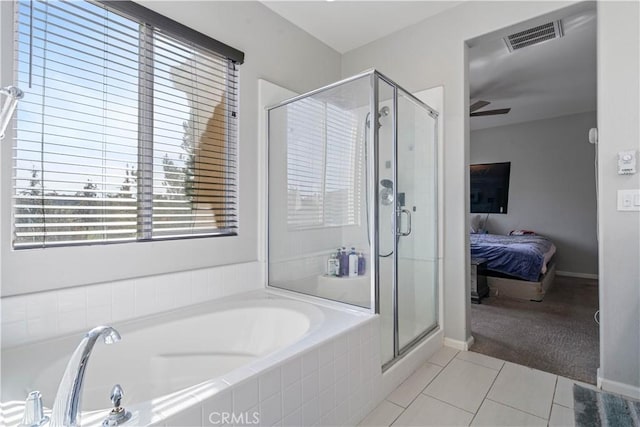 bathroom with tile patterned floors and an enclosed shower