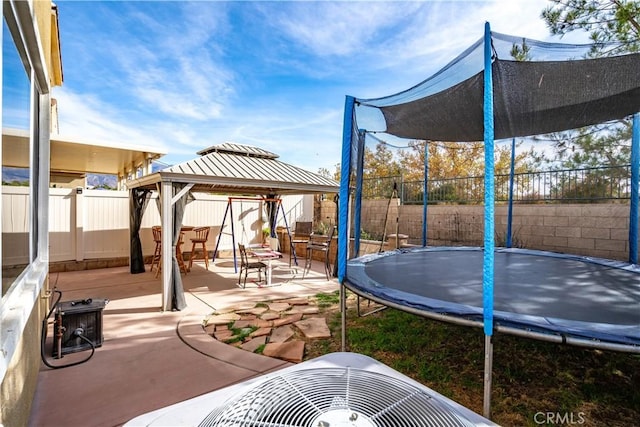 view of patio / terrace with a gazebo and a trampoline