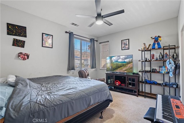 bedroom with ceiling fan and carpet