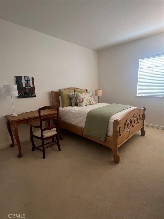 bedroom with light colored carpet