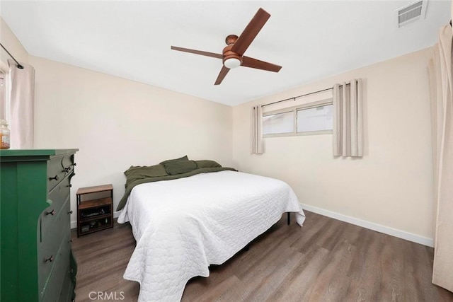 bedroom featuring dark wood-type flooring and ceiling fan