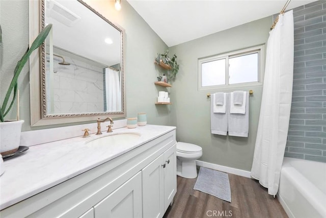 full bathroom with vanity, hardwood / wood-style floors, toilet, and shower / bath combo with shower curtain