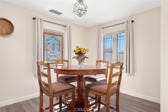 dining room featuring dark wood-type flooring