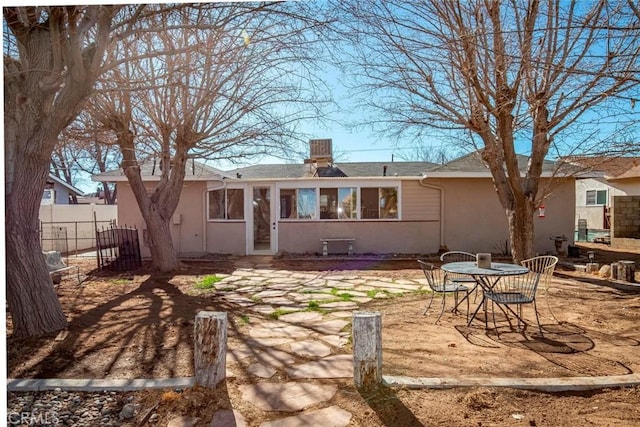 back of property featuring a patio