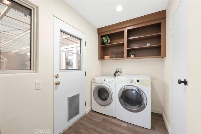 washroom with independent washer and dryer and dark hardwood / wood-style floors