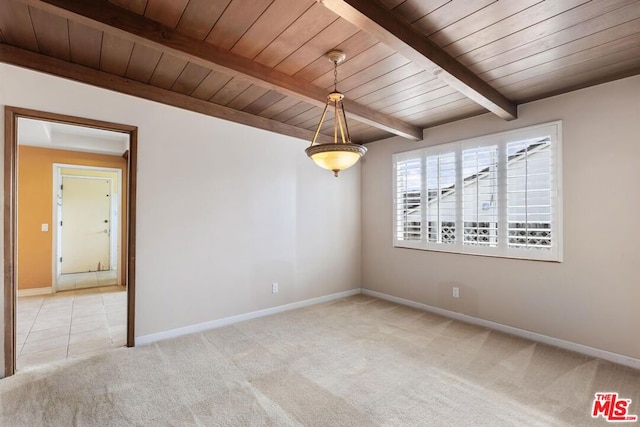 carpeted spare room featuring wooden ceiling and beam ceiling