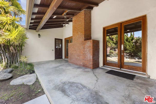 entrance to property with a patio area and french doors