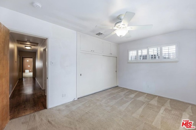 empty room featuring ceiling fan and carpet floors