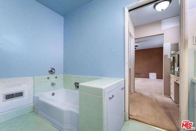 bathroom featuring vanity and a bathtub