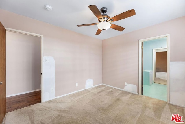 unfurnished bedroom featuring light carpet and ceiling fan