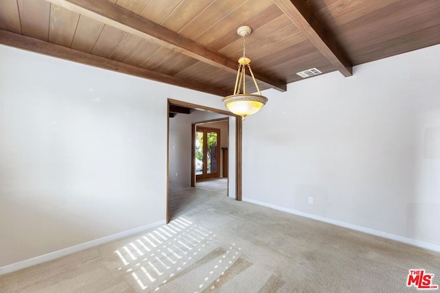 unfurnished room featuring beamed ceiling, carpet, and wooden ceiling