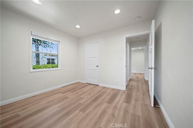 unfurnished bedroom featuring light wood-type flooring