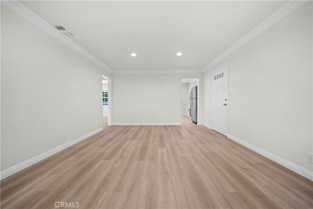 interior space featuring ornamental molding and light hardwood / wood-style floors