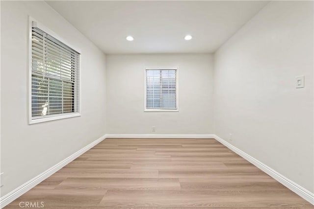 empty room with a healthy amount of sunlight and light wood-type flooring