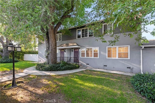 view of front of house with a front lawn