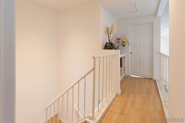 corridor with light hardwood / wood-style flooring