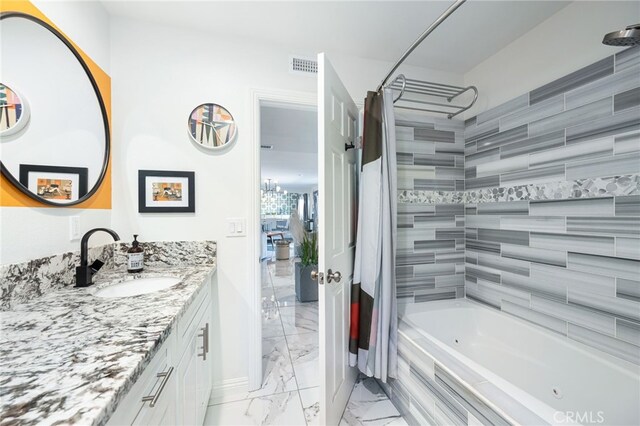 bathroom with vanity and shower / bath combo with shower curtain