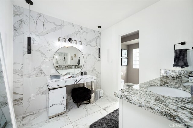 bathroom with vanity and toilet