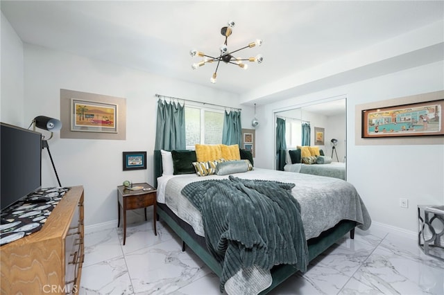 bedroom featuring a notable chandelier and a closet