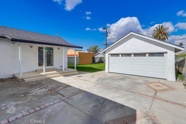 garage featuring a lawn