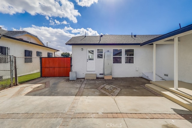 back of property featuring a patio