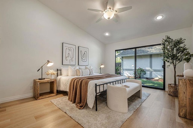 bedroom featuring ceiling fan, lofted ceiling, light hardwood / wood-style flooring, and access to outside