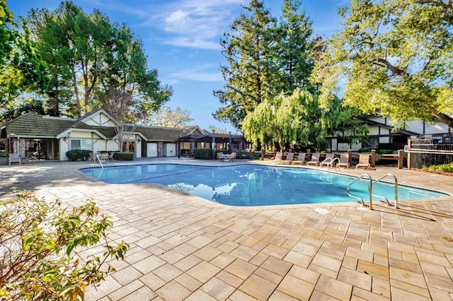 view of swimming pool featuring a patio area