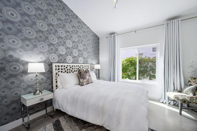 bedroom featuring concrete floors