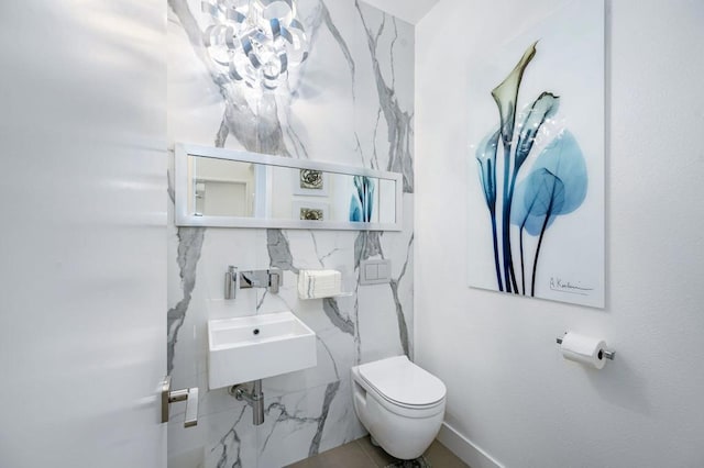 bathroom featuring sink and toilet