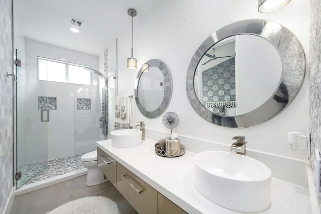 bathroom with vanity, toilet, and walk in shower