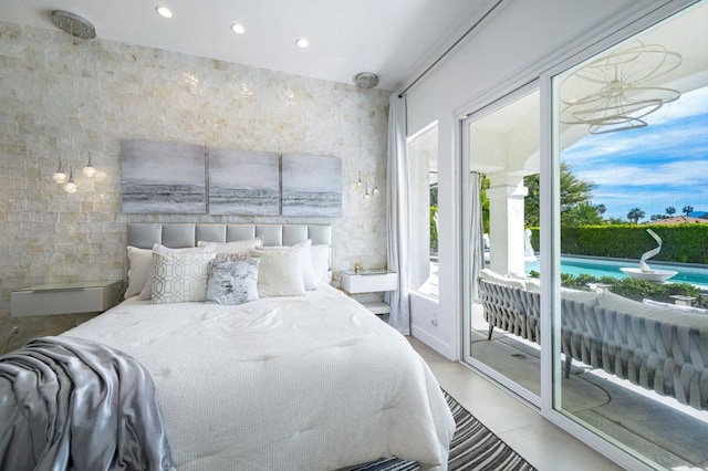 bedroom featuring tile walls and access to outside