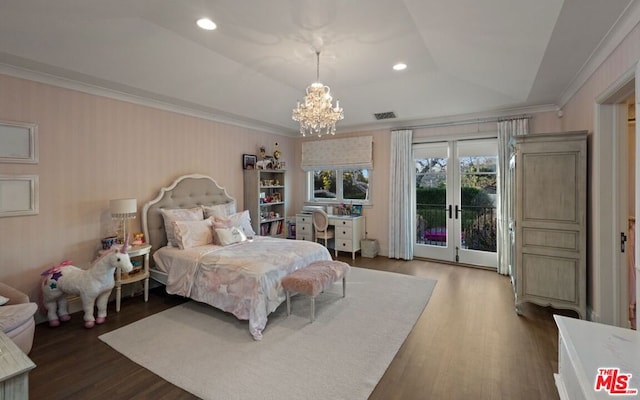 bedroom featuring dark hardwood / wood-style floors, ornamental molding, a notable chandelier, access to exterior, and a raised ceiling