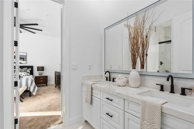 bathroom with vanity, an enclosed shower, and ceiling fan