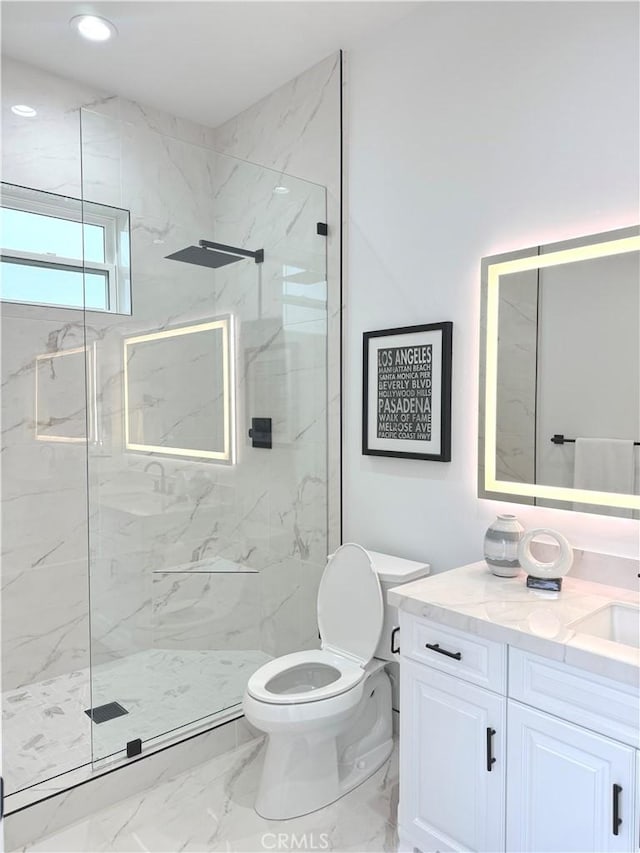 bathroom with vanity, toilet, and walk in shower