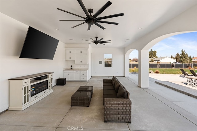 view of patio featuring outdoor lounge area, area for grilling, and ceiling fan