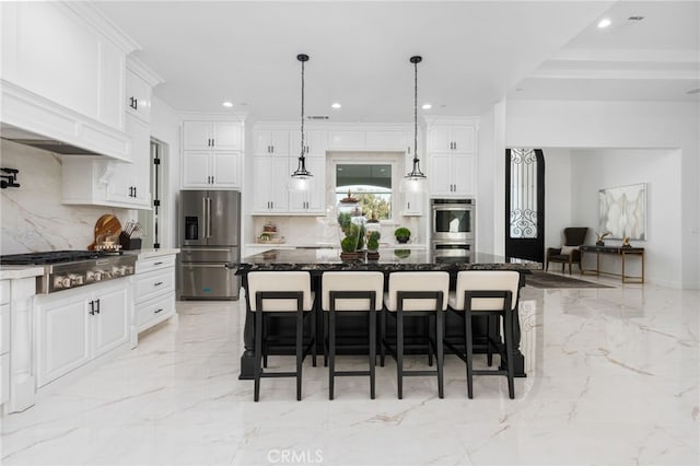 kitchen featuring hanging light fixtures, dark stone countertops, a kitchen breakfast bar, stainless steel appliances, and a large island