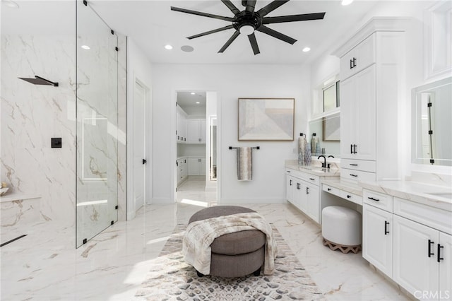 bathroom featuring walk in shower, ceiling fan, and vanity