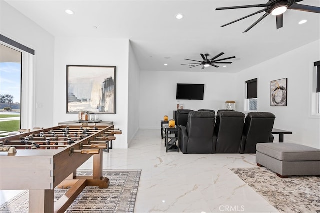 cinema room featuring ceiling fan