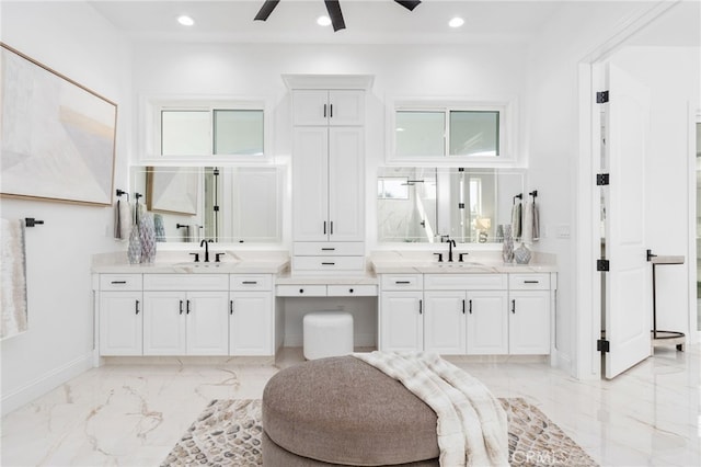 bathroom featuring ceiling fan and vanity