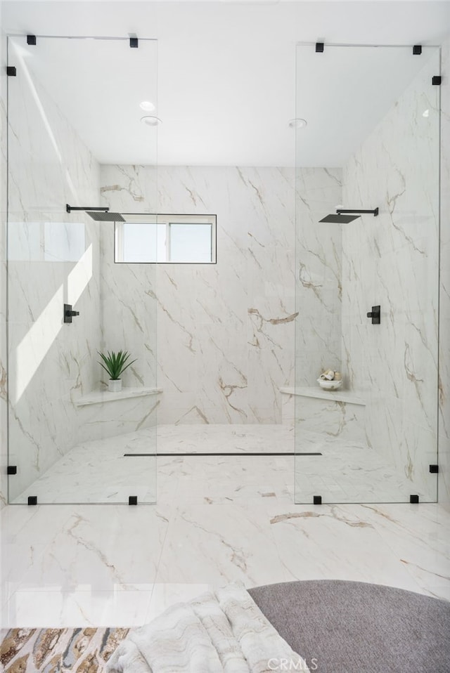 bathroom with a tile shower