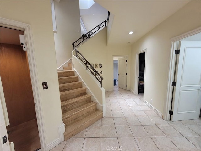 stairs featuring tile patterned floors