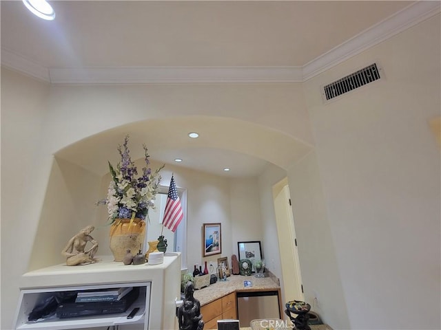 interior space with fridge, crown molding, recessed lighting, arched walkways, and visible vents