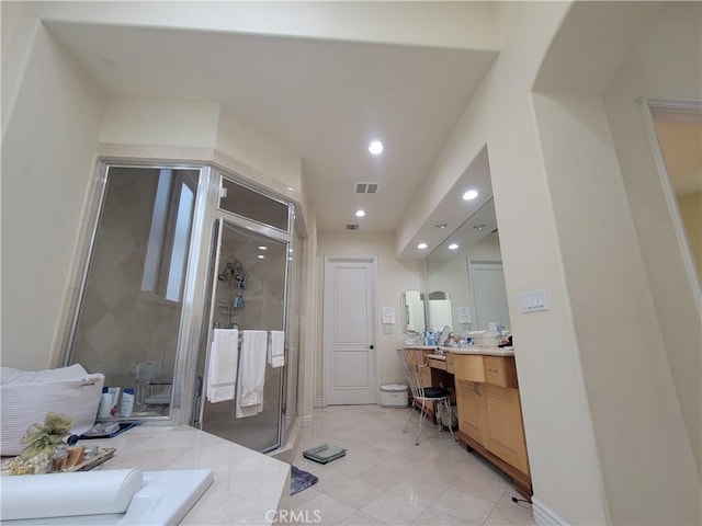 full bathroom with vanity, a shower stall, recessed lighting, and visible vents