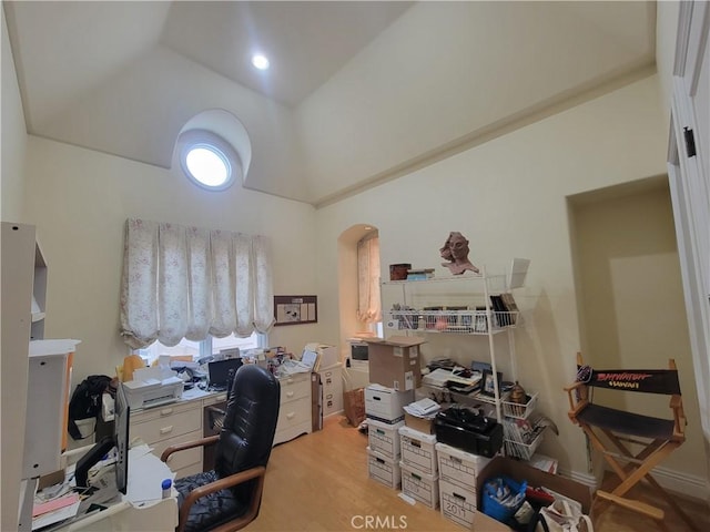 home office with light hardwood / wood-style floors