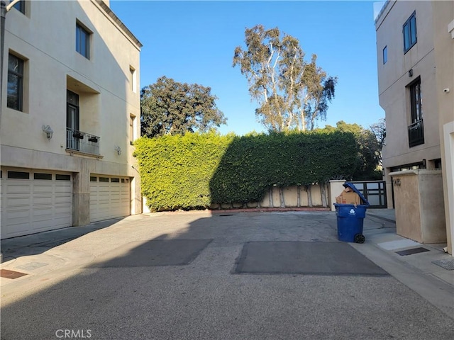 view of car parking featuring a garage