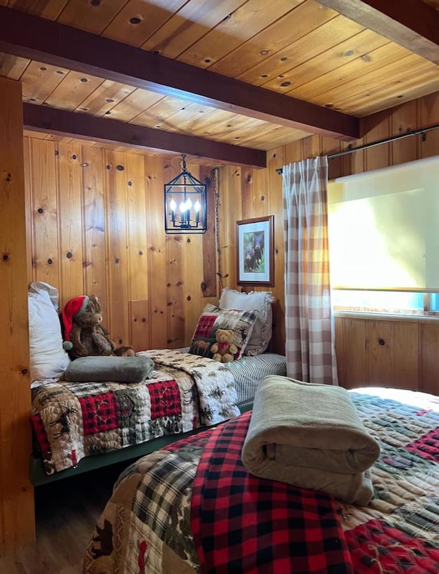 bedroom featuring beamed ceiling, hardwood / wood-style flooring, wooden walls, and wood ceiling