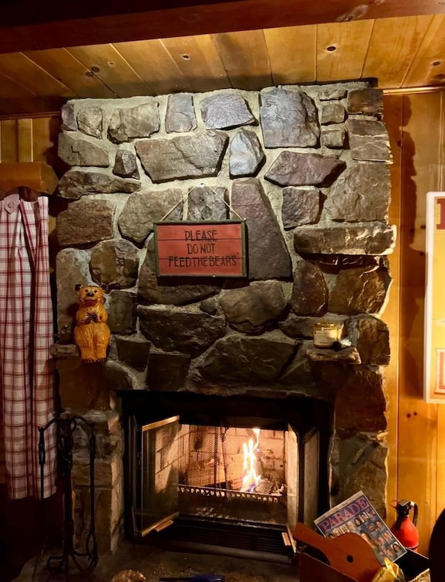 interior details featuring wood ceiling and a fireplace