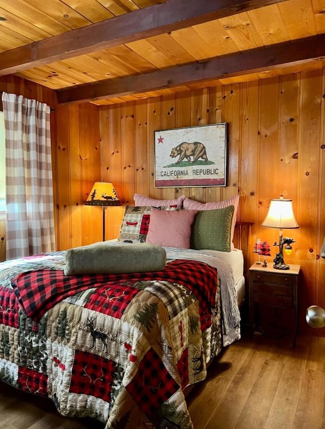 bedroom with wooden walls, hardwood / wood-style floors, wooden ceiling, and beam ceiling