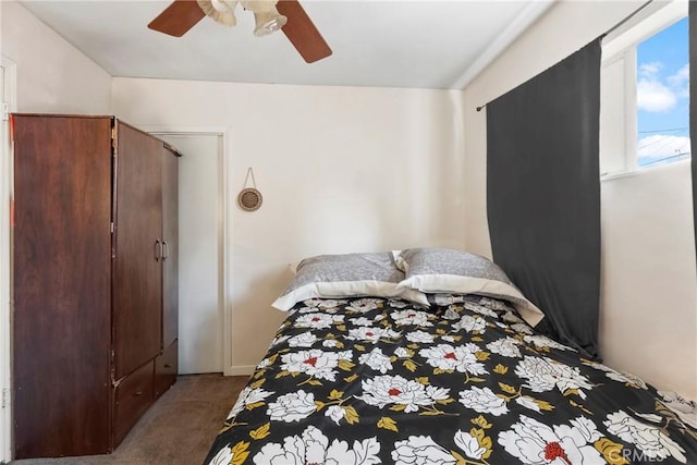 bedroom featuring ceiling fan and carpet flooring