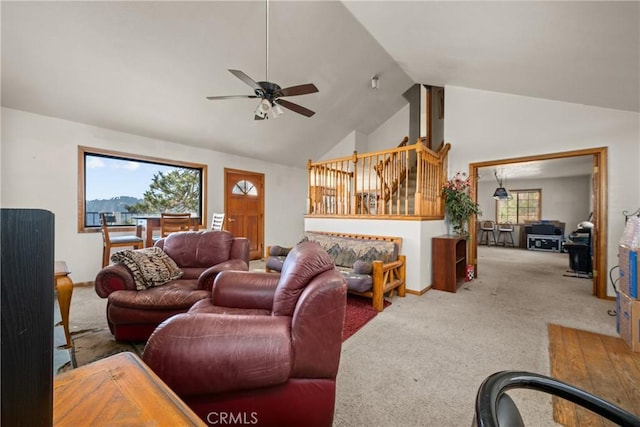 living room featuring ceiling fan, carpet flooring, and high vaulted ceiling